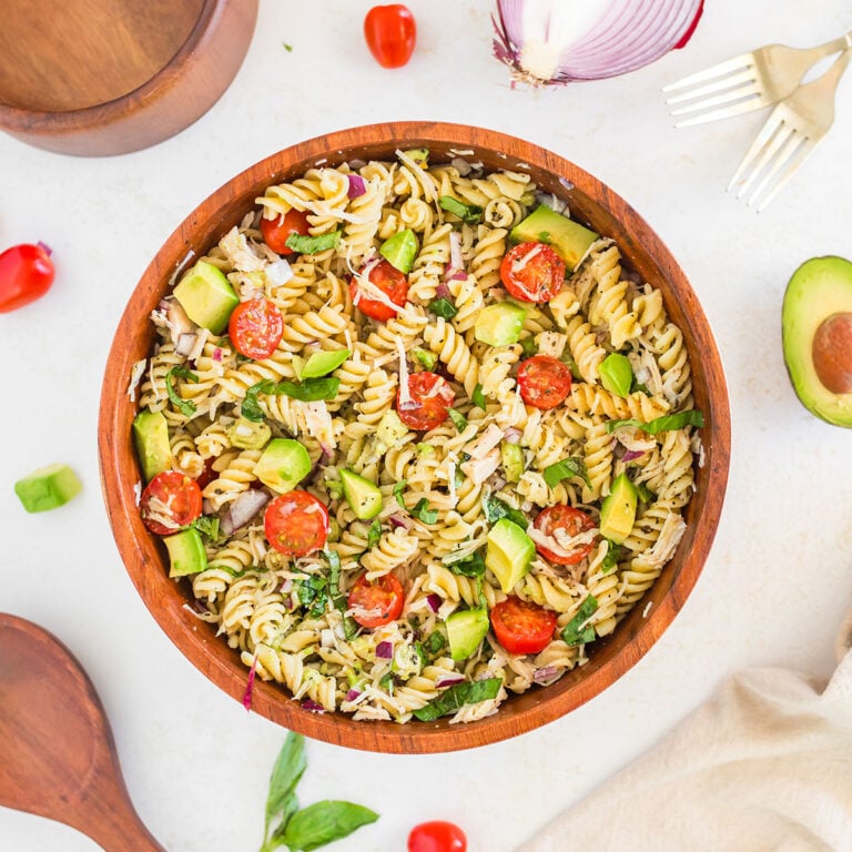 Avocado Chicken Pasta Salad in a wooden bowl.