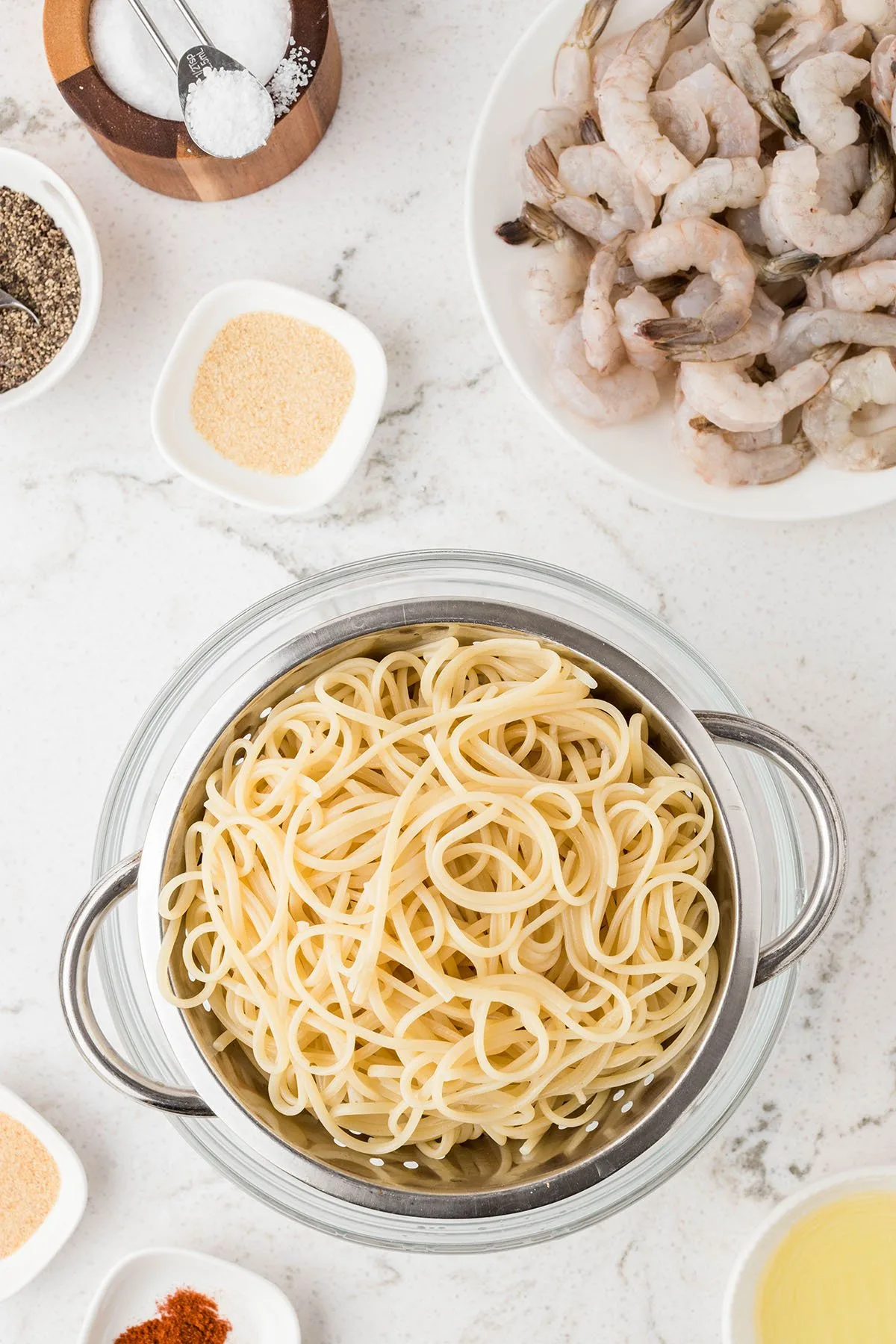 Cooked pasta in a strainer.