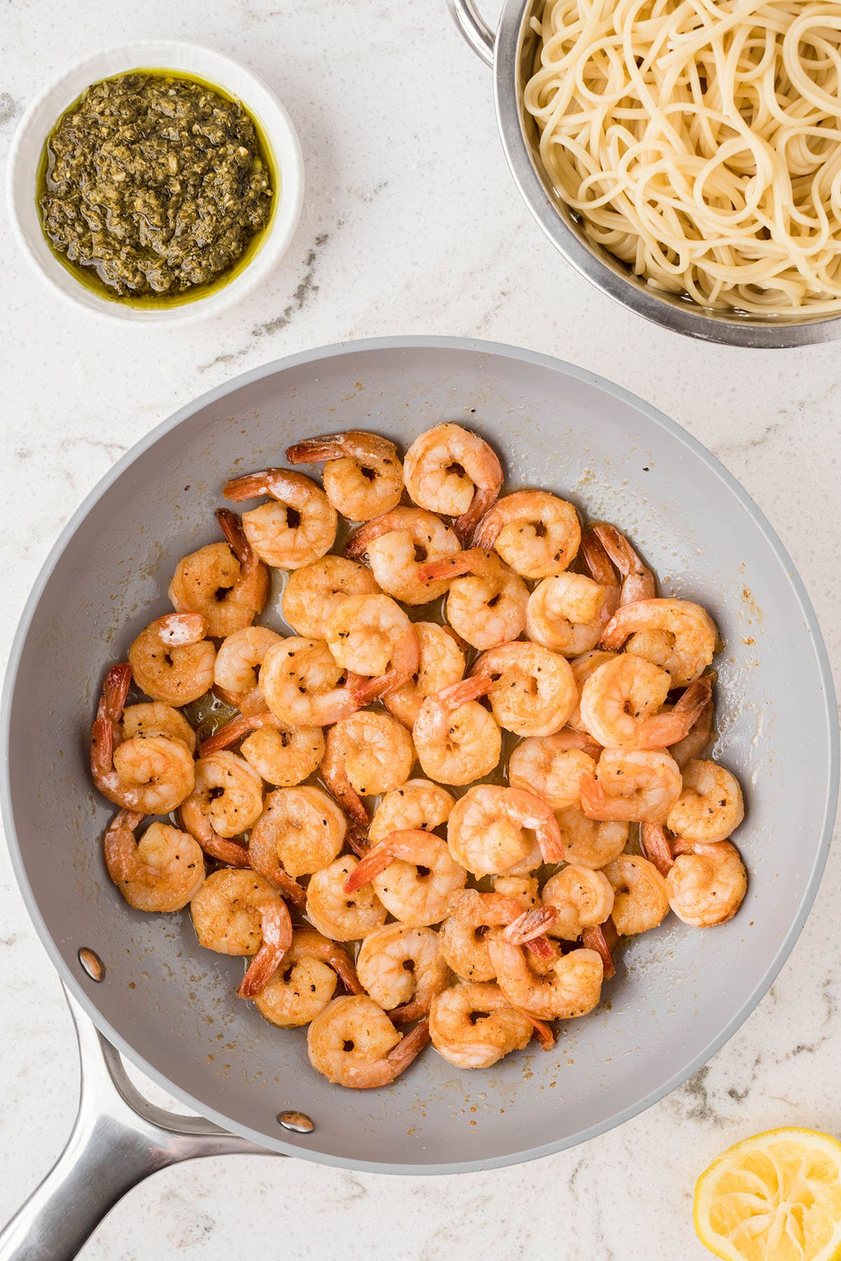 Seasoned shrimp in a skillet.