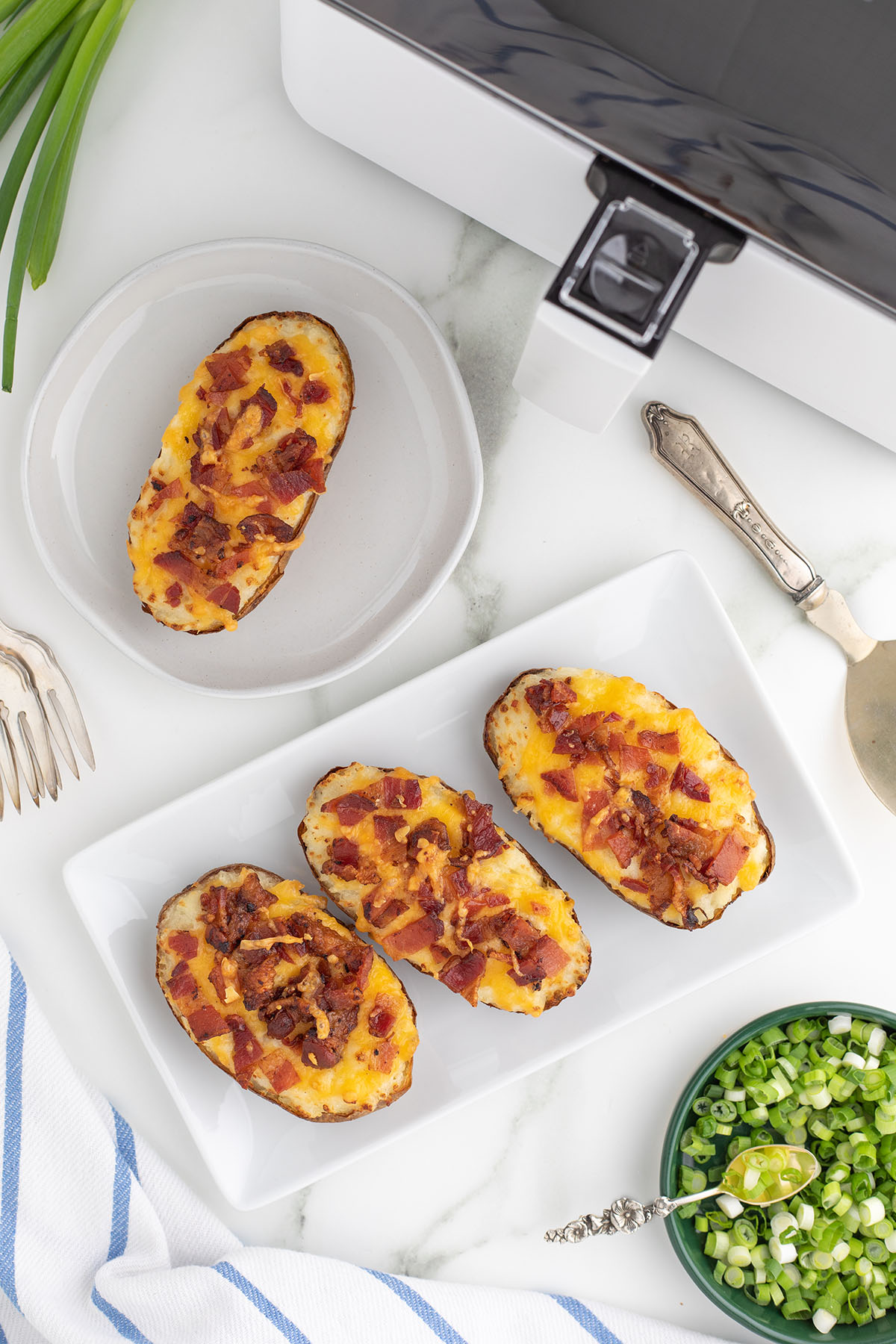 Twice Baked Potatoes on a white serving plate.