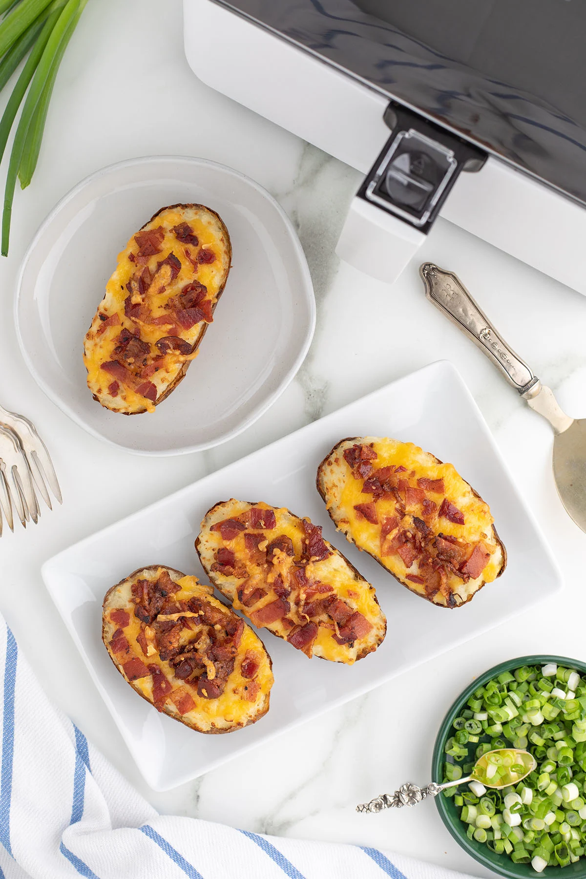 Twice Baked Potatoes on a white serving plate.