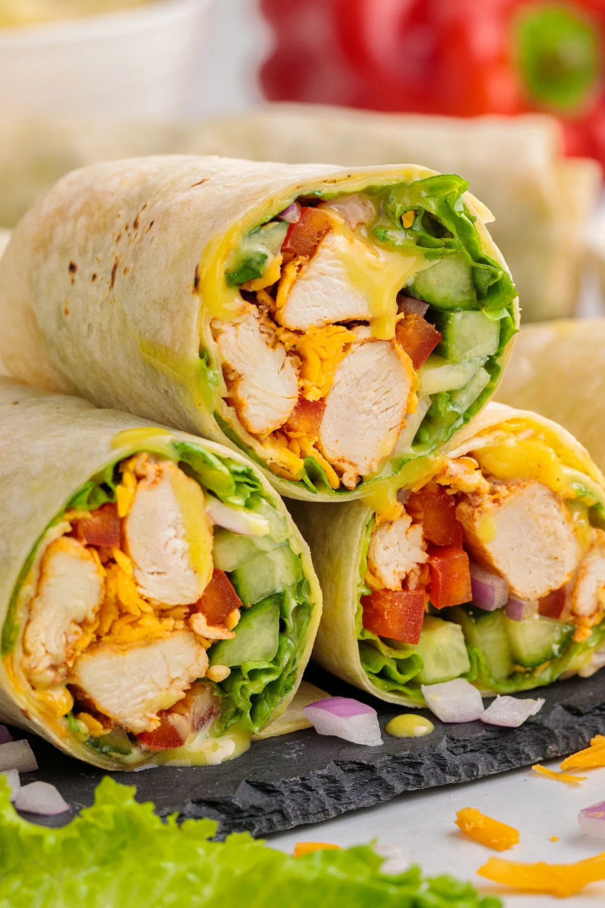 Three Honey Mustard Chicken Wraps stacked on top of each other.
