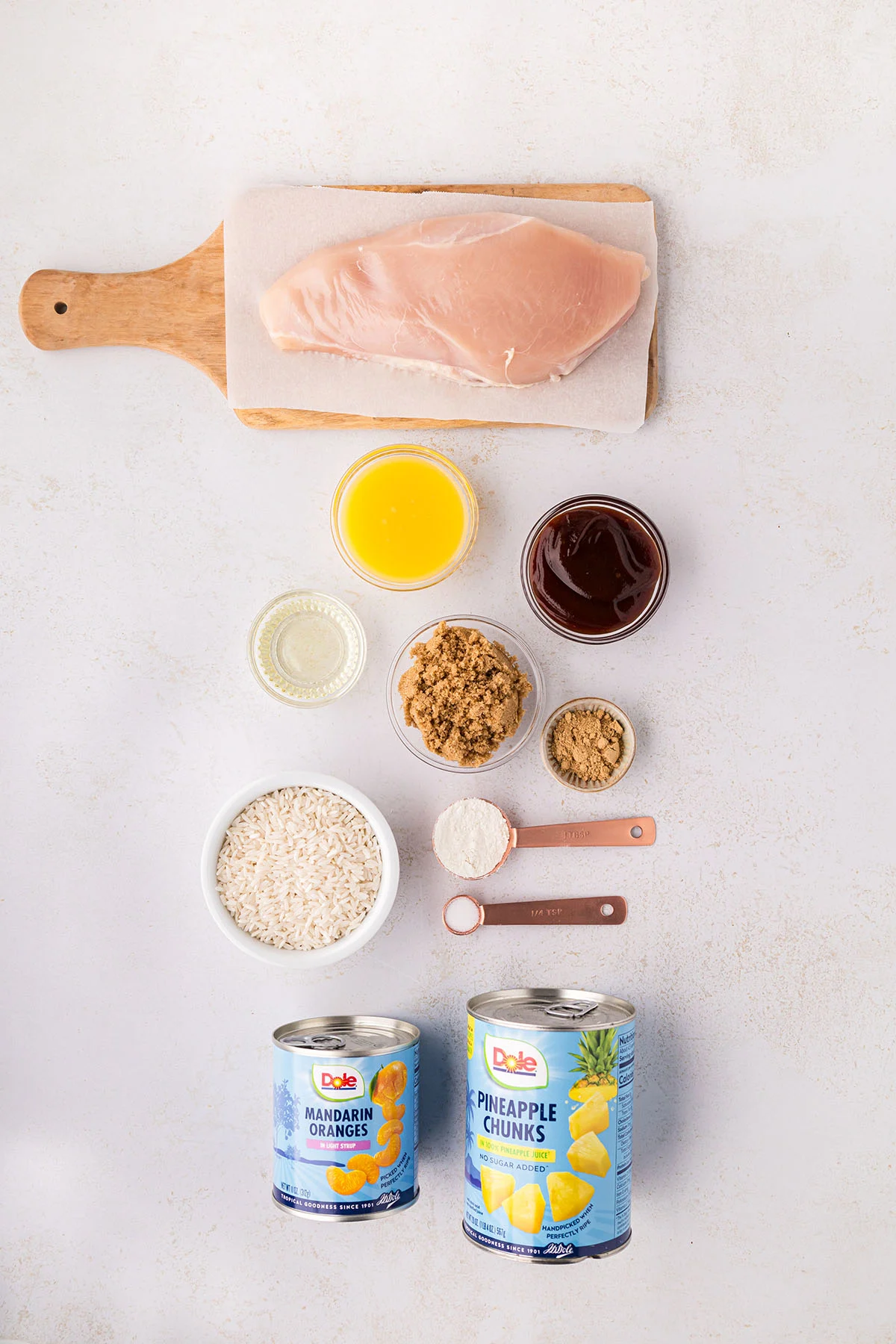 Ingredients to make Hawaiian chicken are set out on the counter.