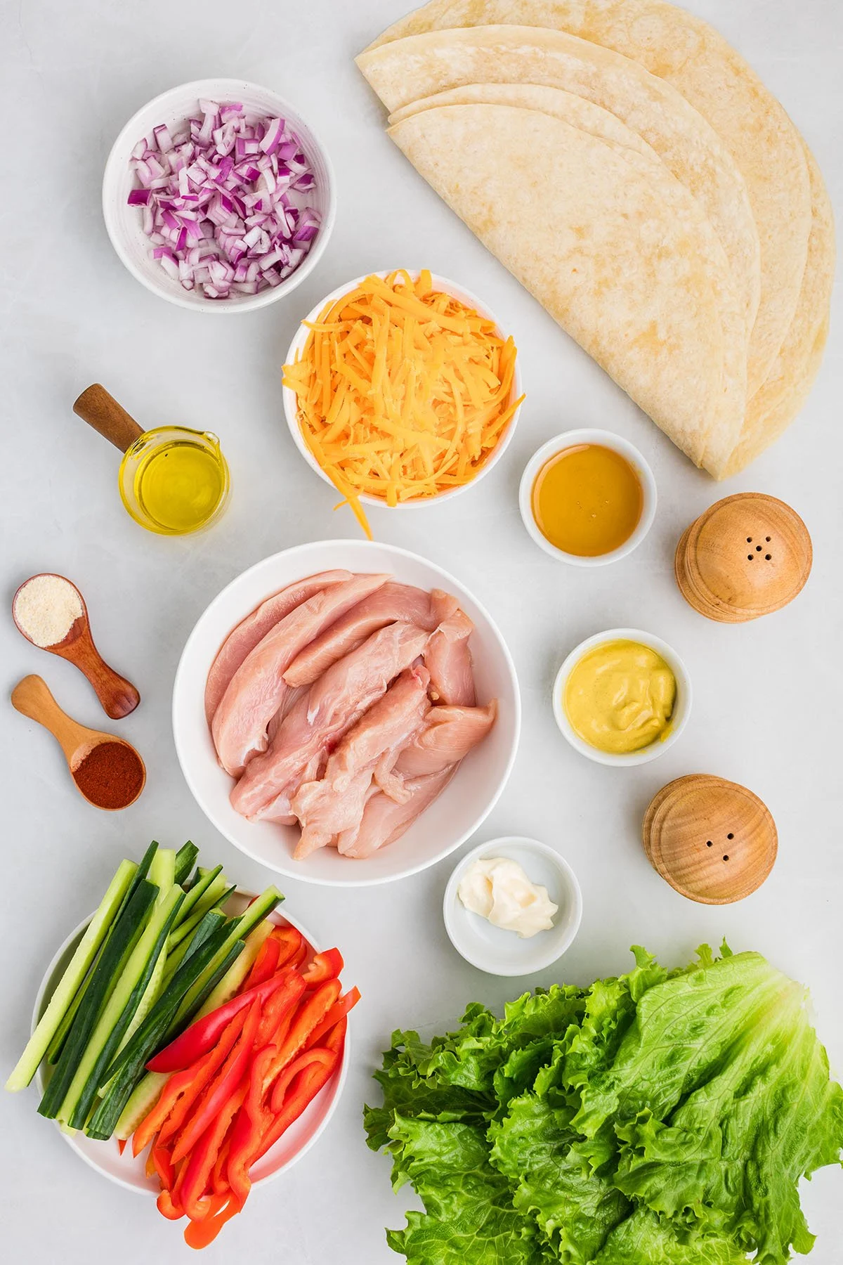 Ingredients to make Honey Mustard Chicken Wraps set out on the counter.