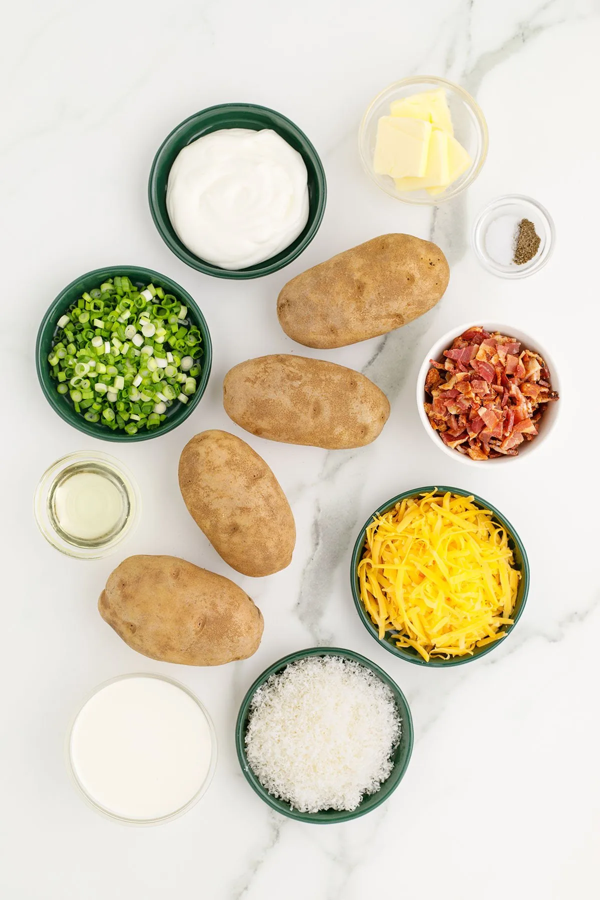 Ingredients to make Twice Baked Potatoes set out on the counter.
