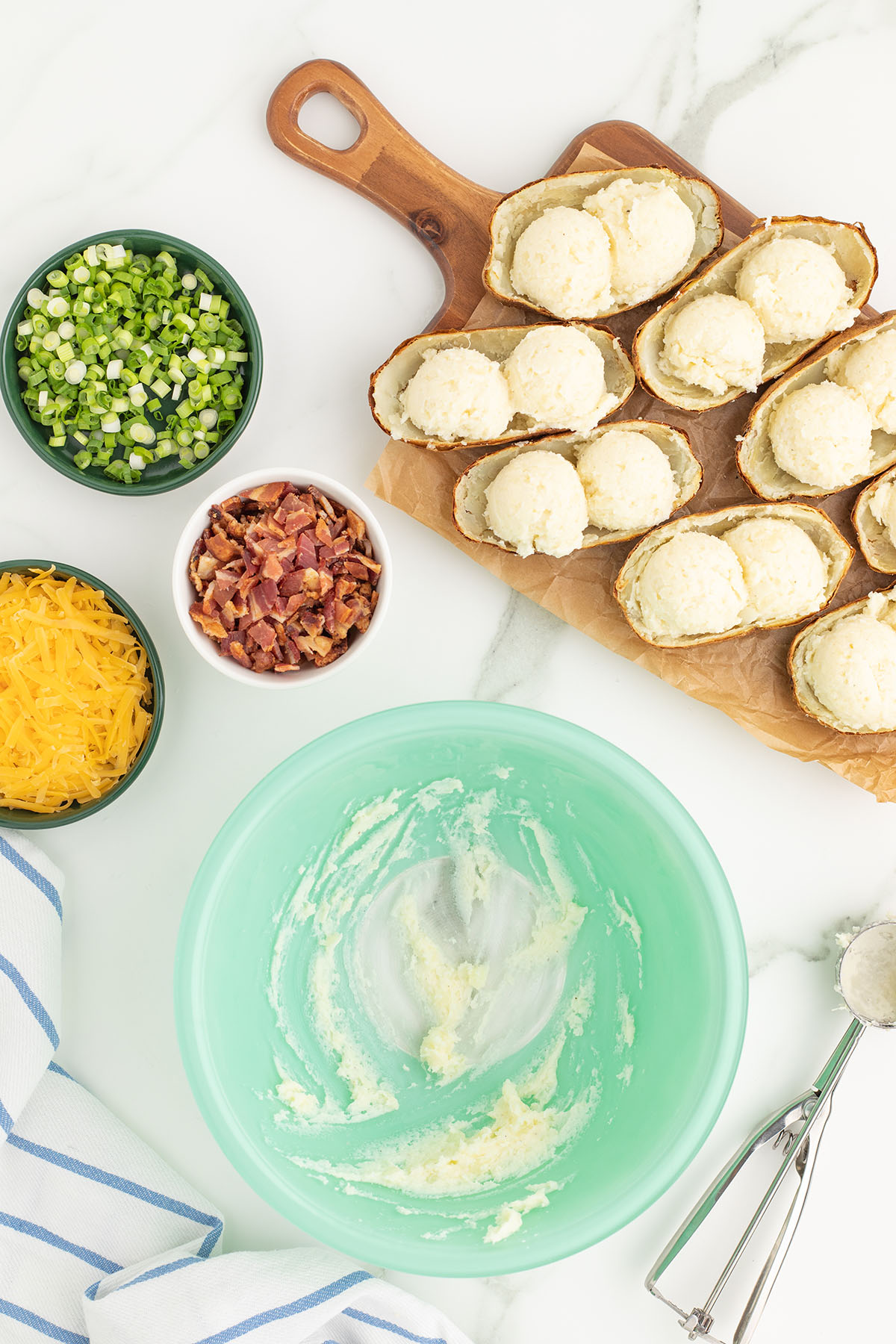 Mashed potato mixture added to the potato skins.