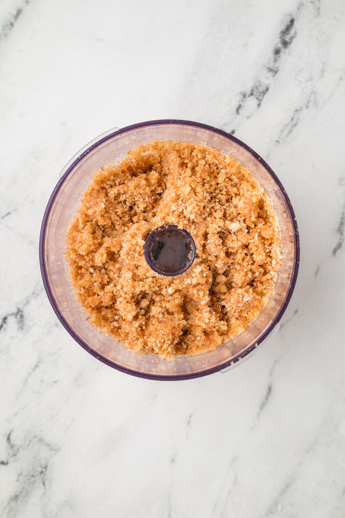 Vanilla wafer crust in a food processor.