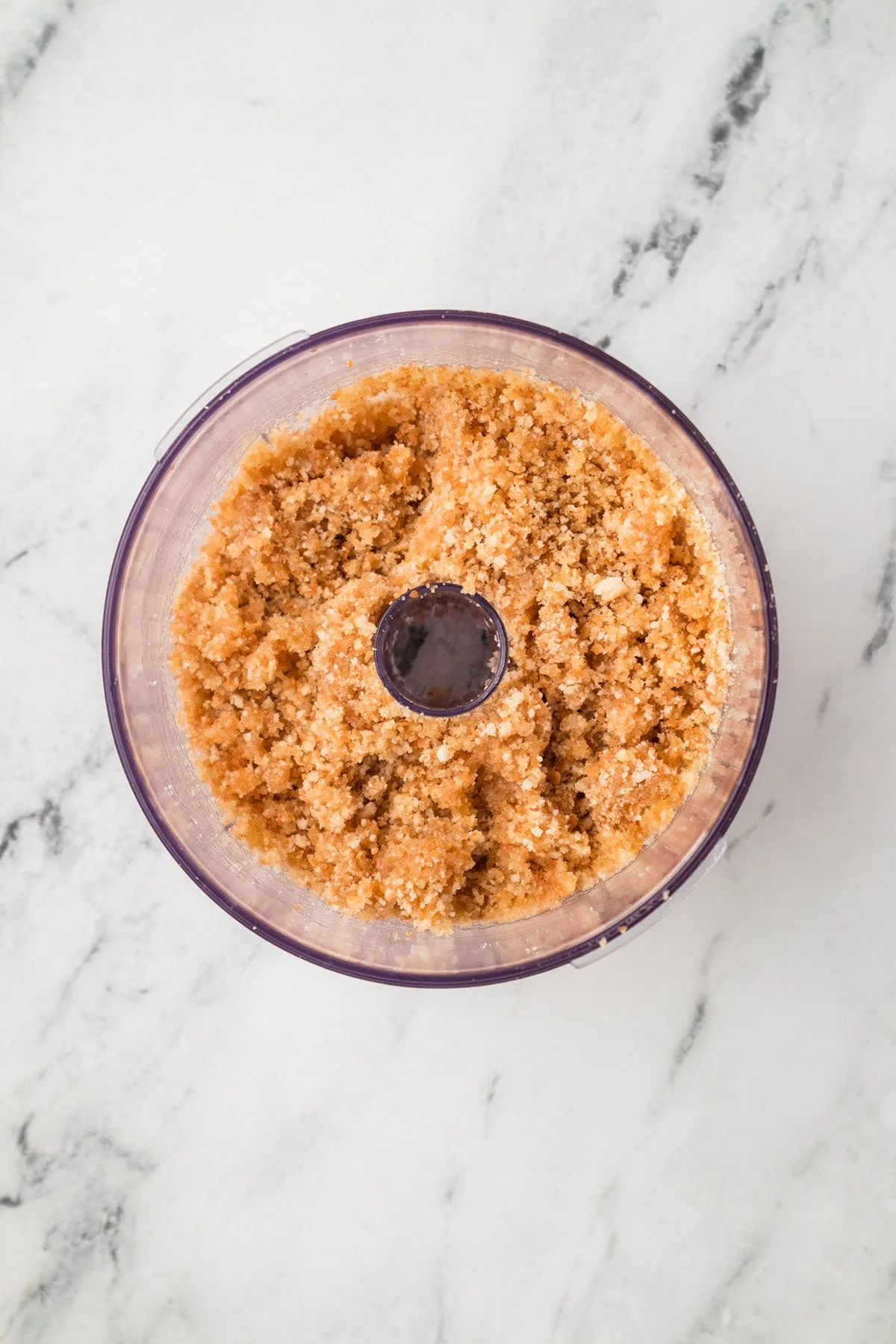 Vanilla wafer crust in a food processor.