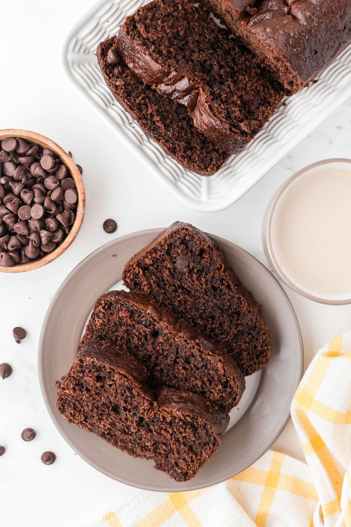 Chocolate Loaf Cake slices on a white plate.