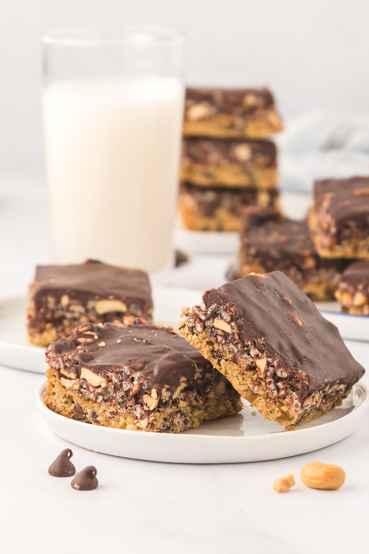Caramel Cashew Cereal Bars on a white plate.