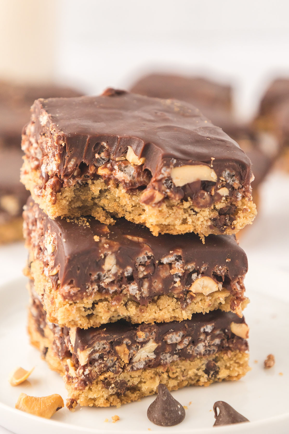 Caramel Cashew Bars stacked tother on a plate.