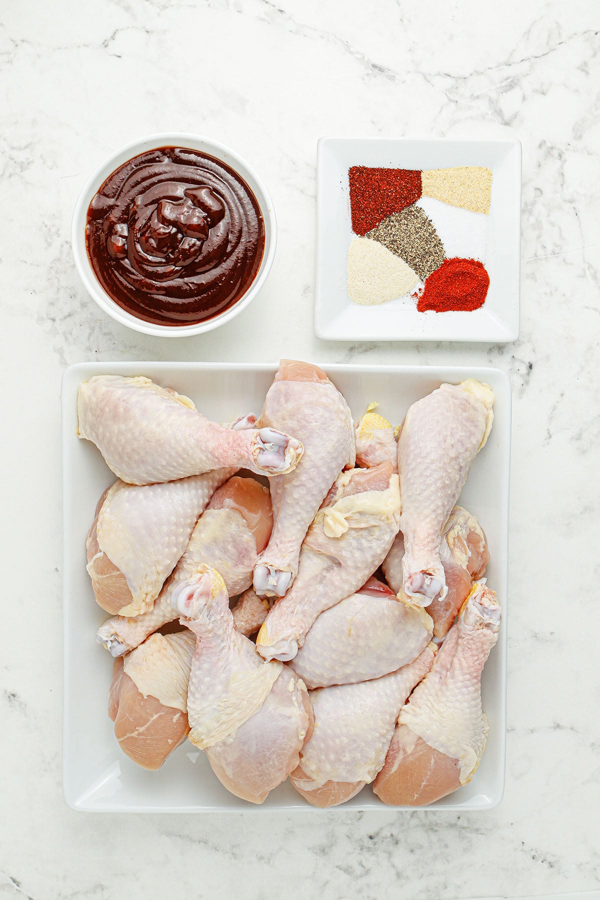 Ingredients to make BBQ Chicken Drumsticks set out on the counter.