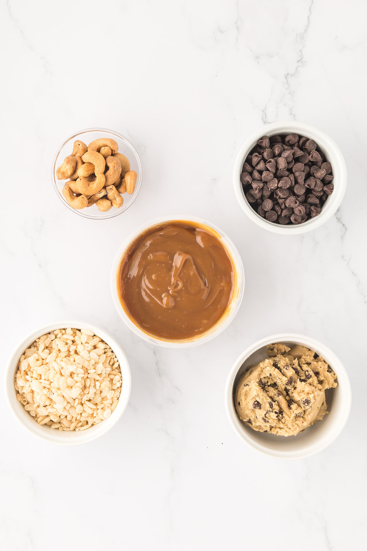 Ingredients to make Caramel Cashew Bars set out on the counter.