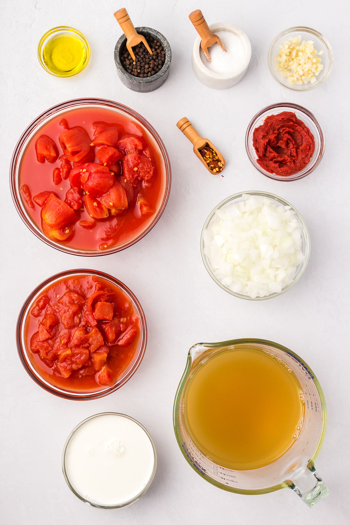 Ingredients for Creamy Tomato Soup are set out on the counter.