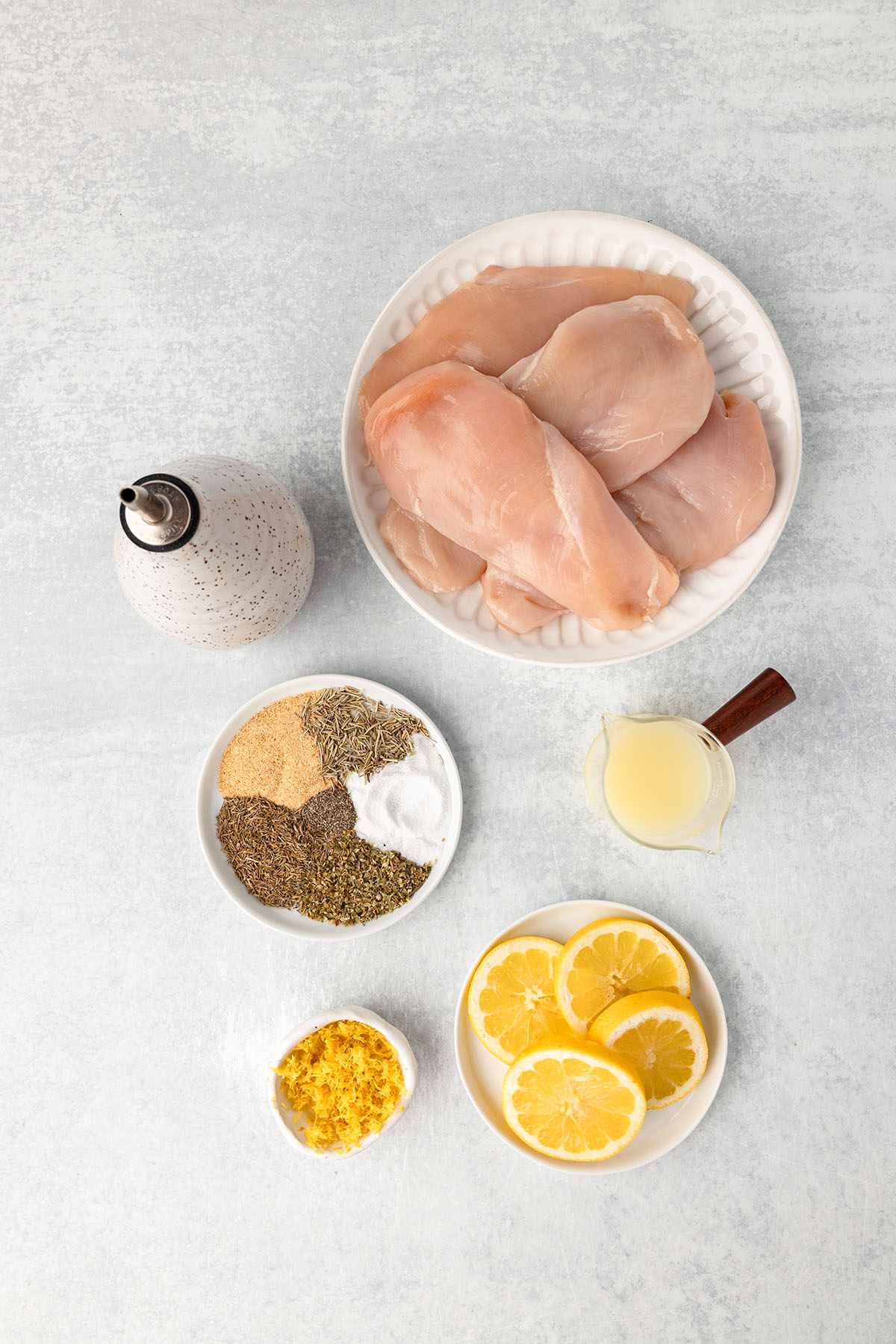 Ingredients to make Lemon Herb Chicken are set out on the counter.