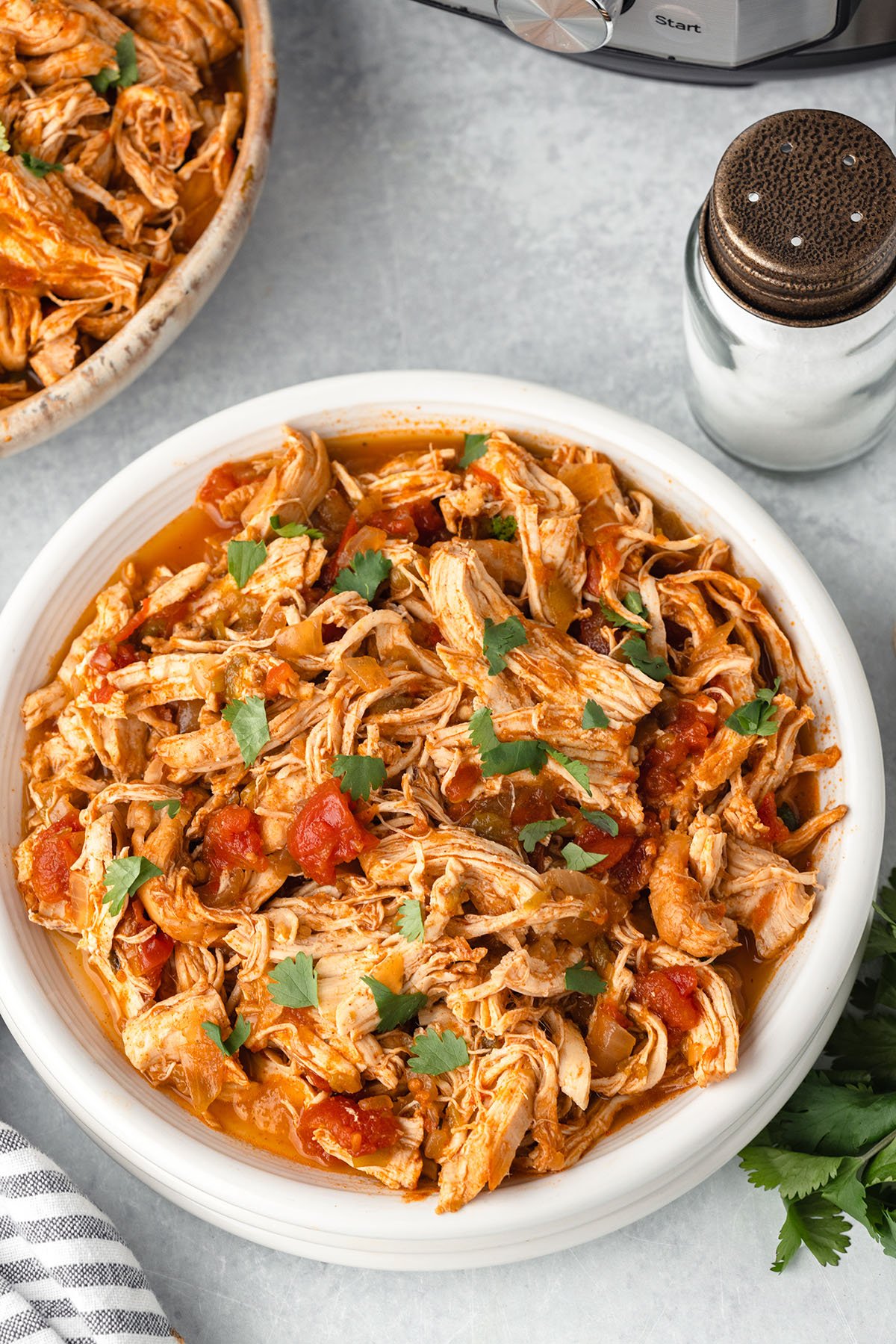 Mexican Shredded Chicken served in a white bowl.