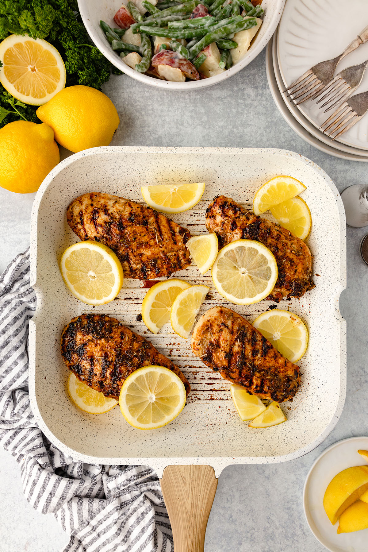 Lemon herb chicken cooked in a grill pan.