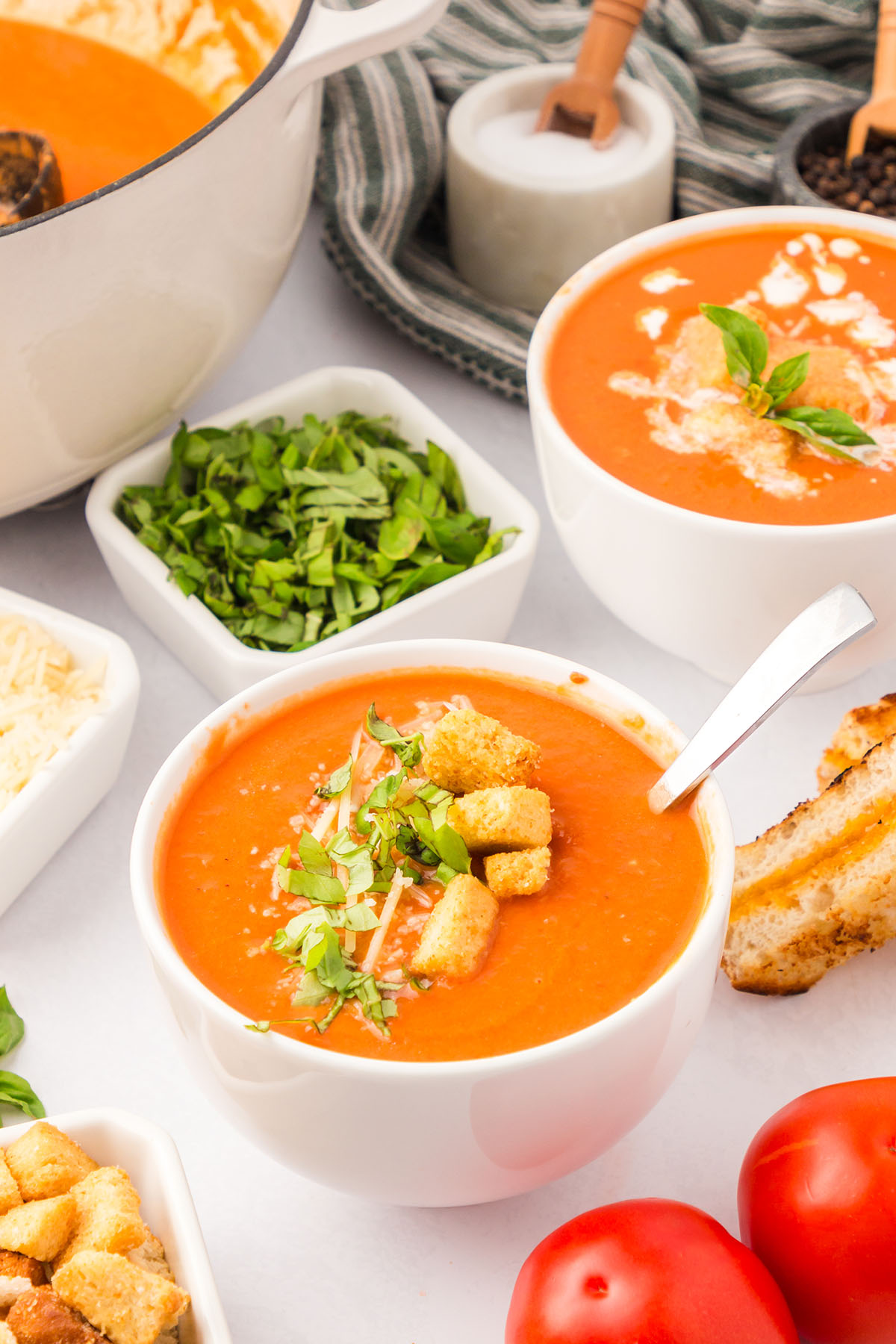 Creamy Tomato Soup served in white bowls.