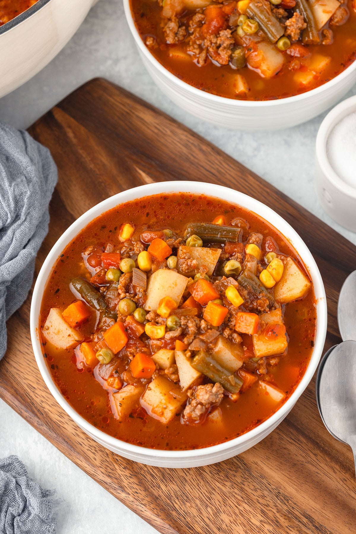 Hamburger Vegetable Soup served in a white bowl.
