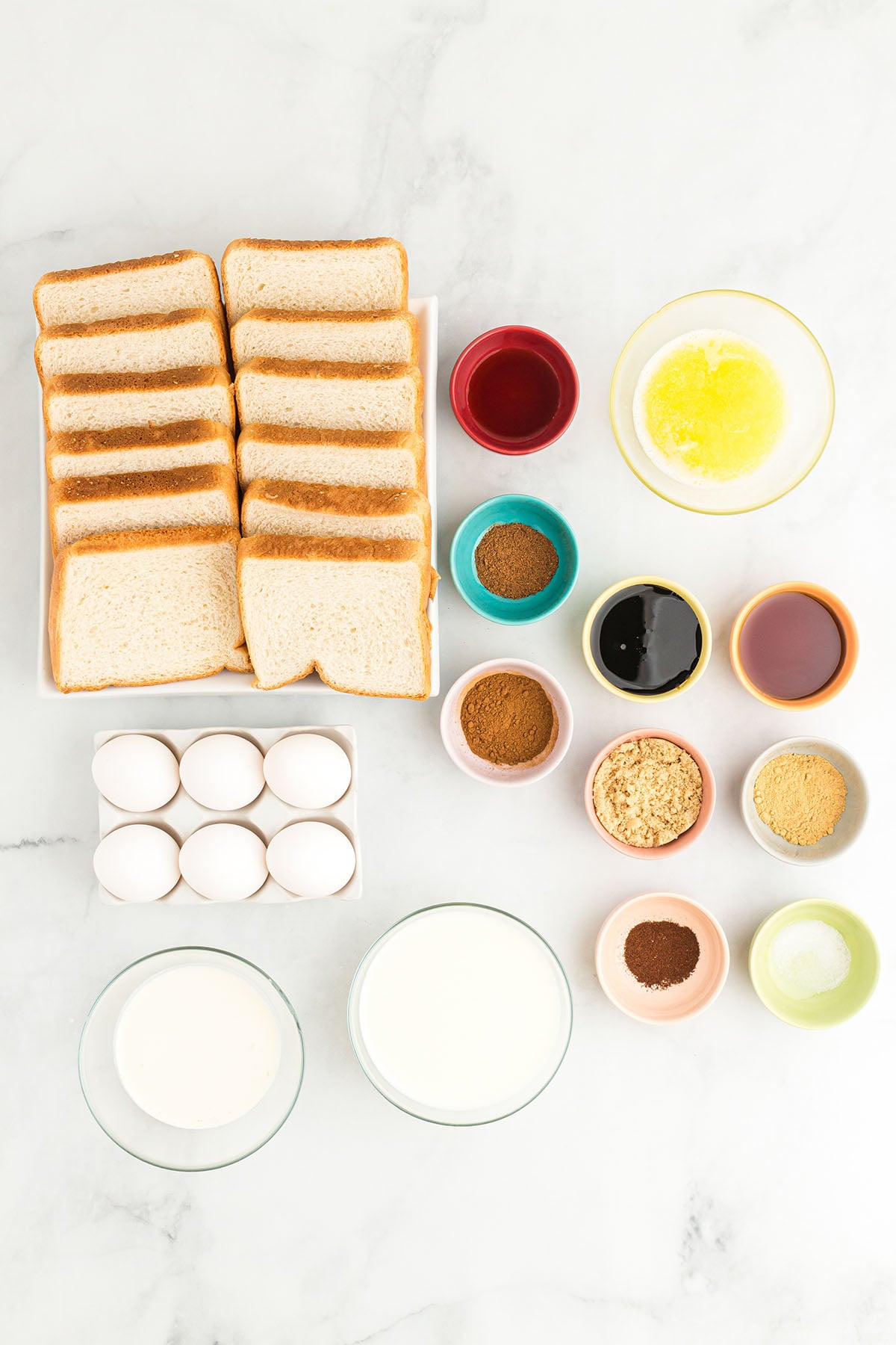 Ingredients to make gingerbread French toast are set out on the counter.