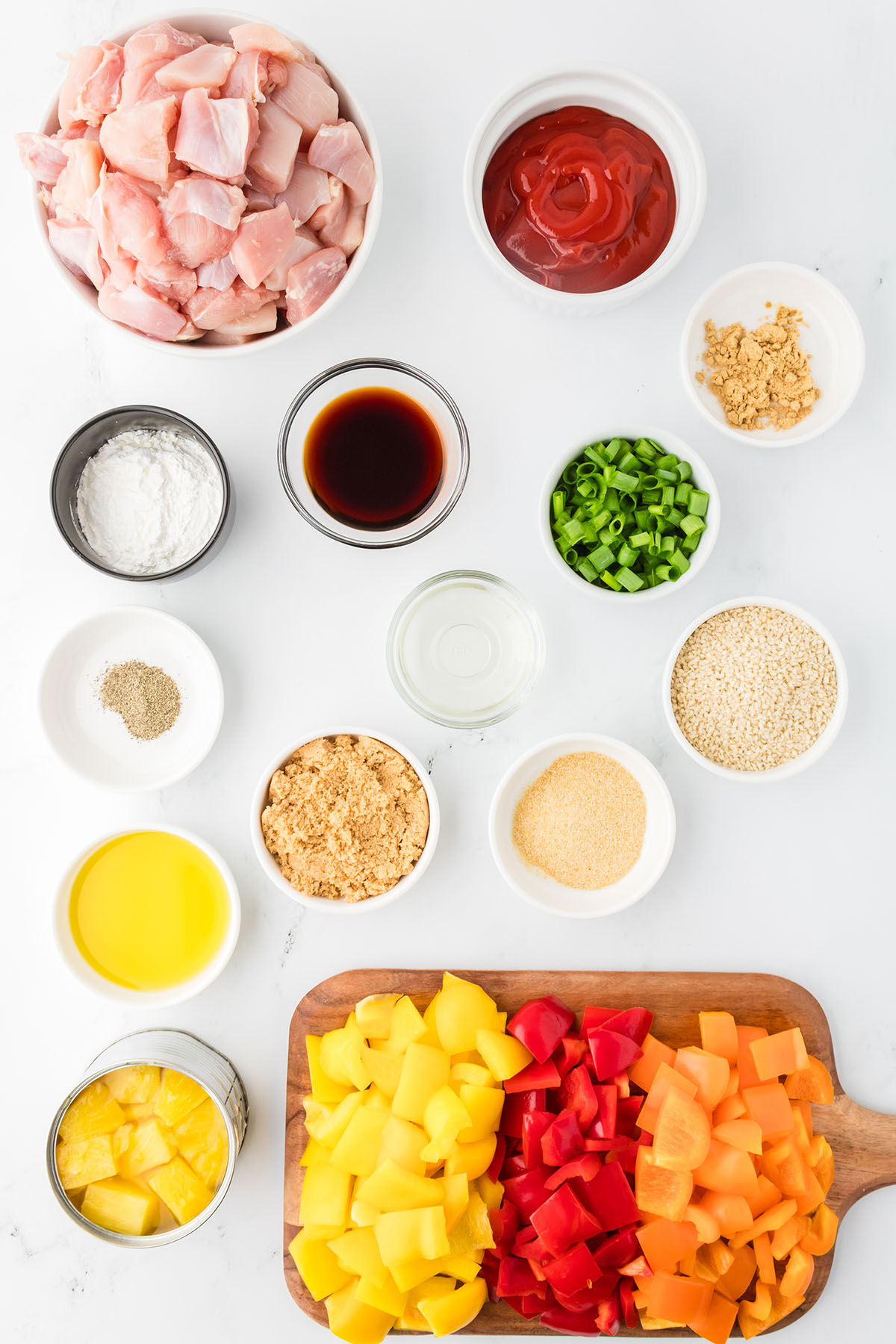 Ingredients to make sweet and sour chicken are set out on the counter.