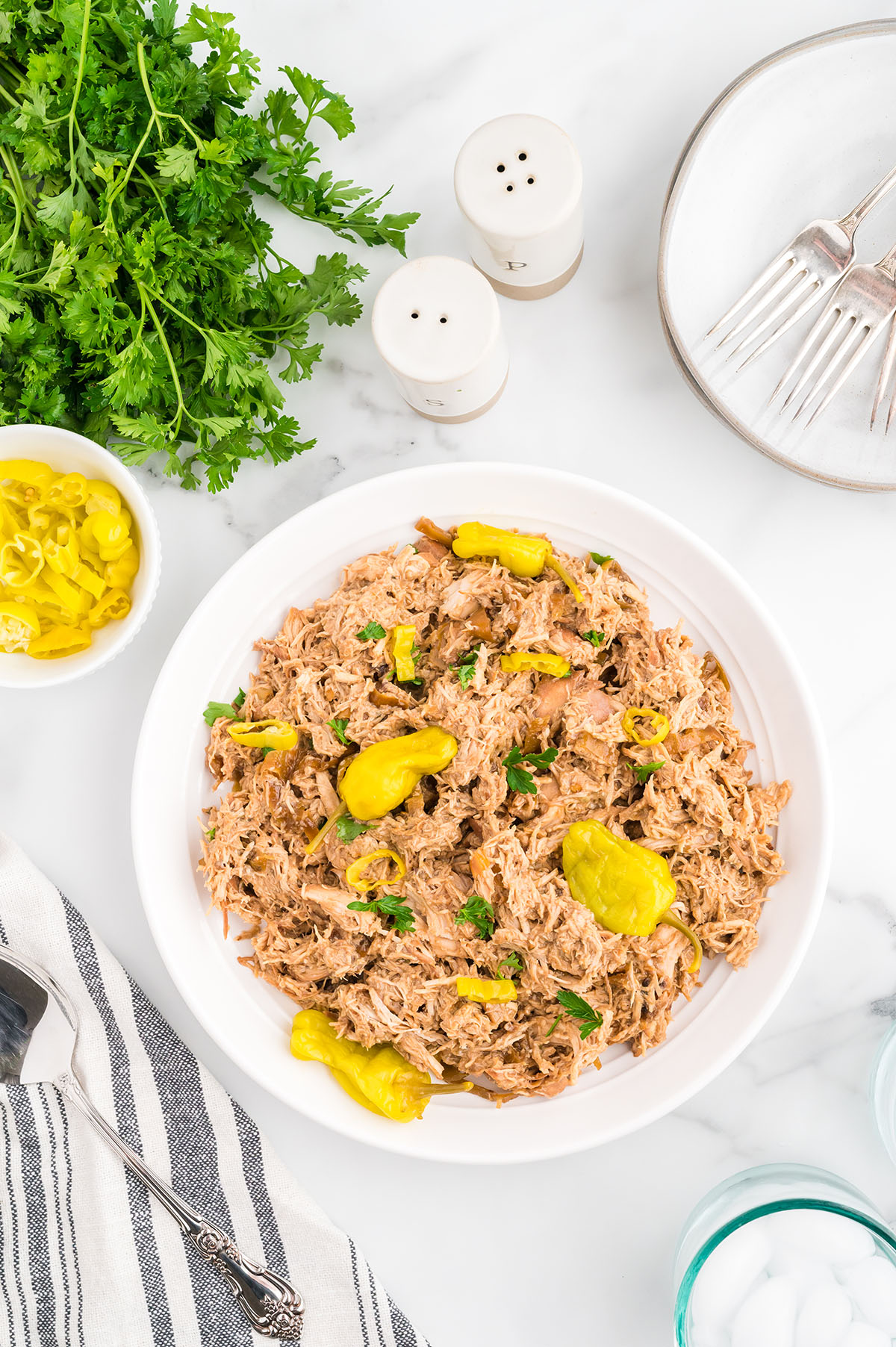 Shredded Mississippi Chicken in a white bowl.