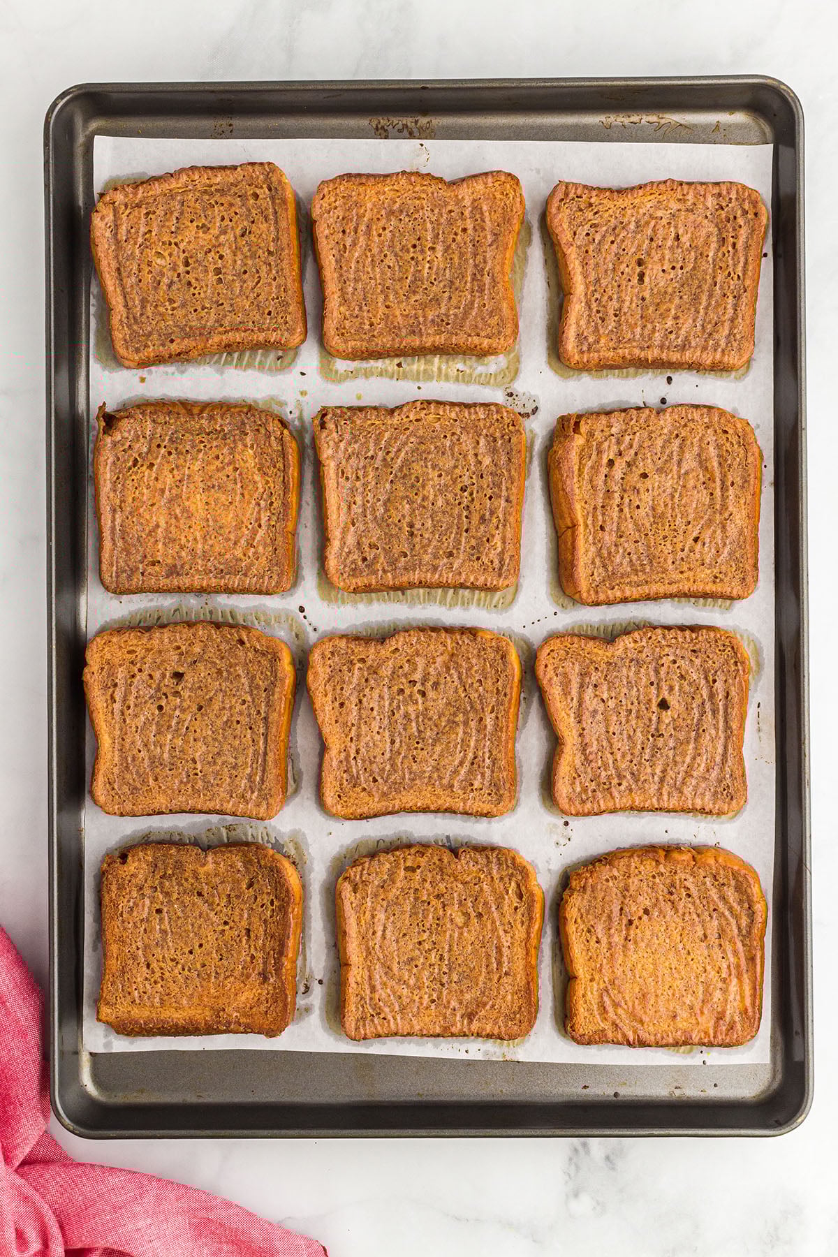 Baked gingerbread French toast on a sheet pan.