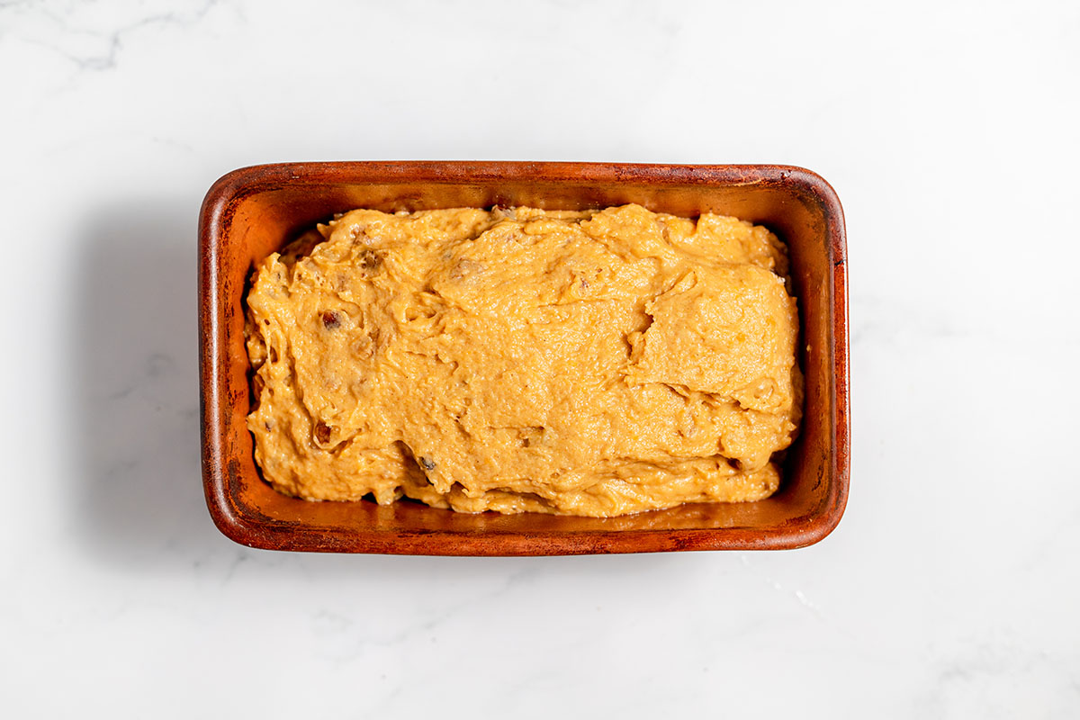 Sweet potato bread batter in a loaf baking pan.