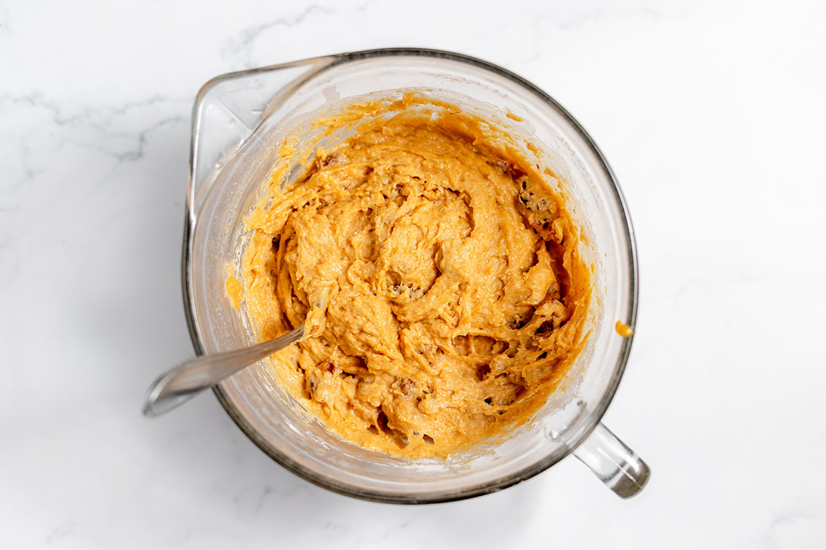 Sweet potato bread batter in a glass mixing bowl.