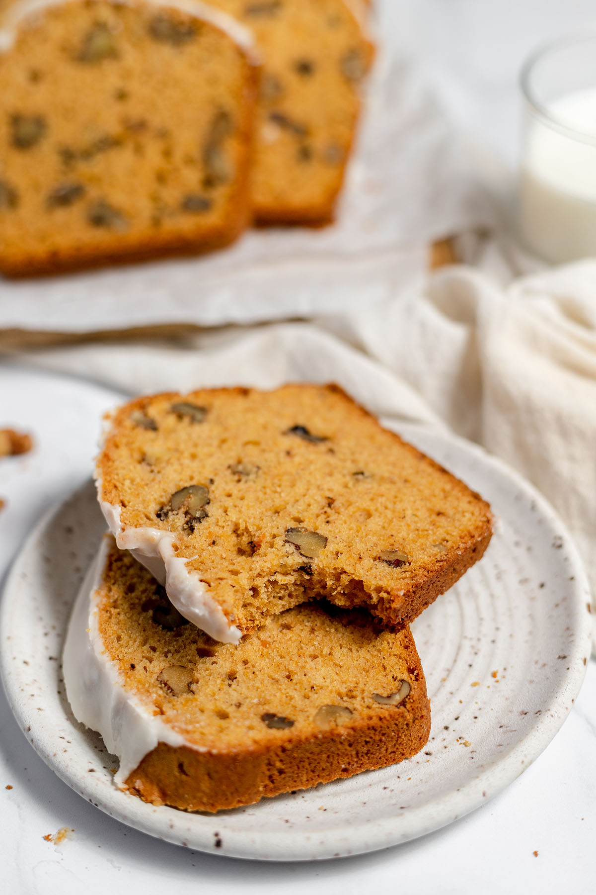 Two slices of sweet potato bread on a white plate.
