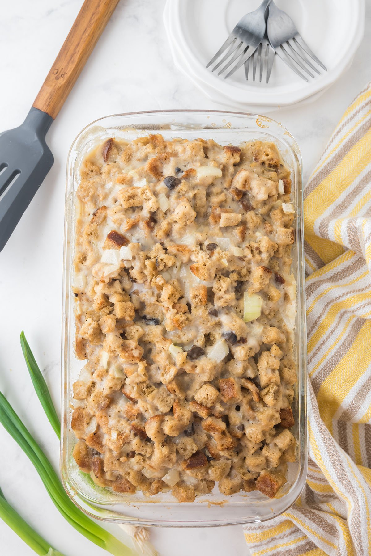 Baked Pork Chops and Stuffing in a glass baking dish.