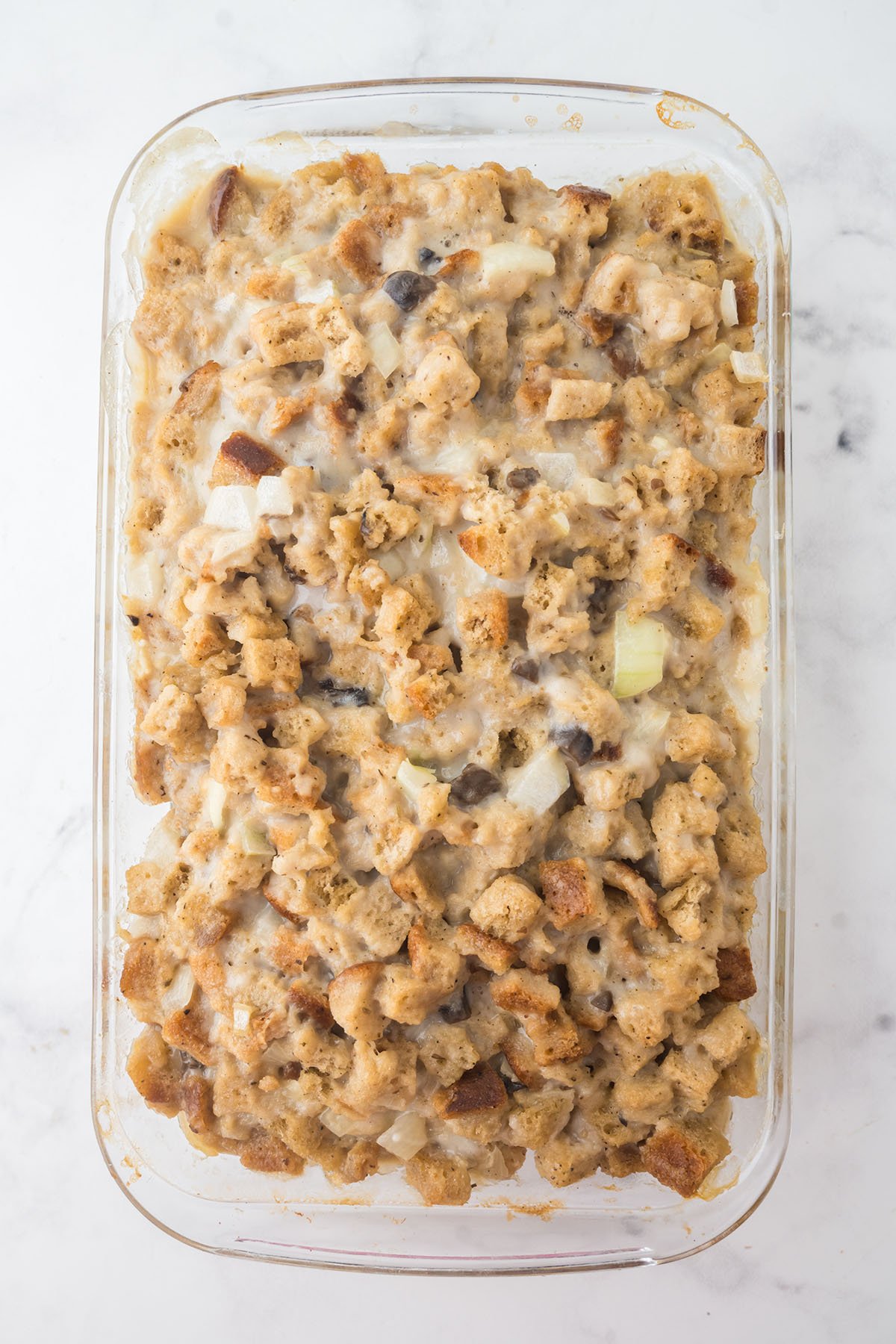 Baked pork chops and stuffing in a baking dish.