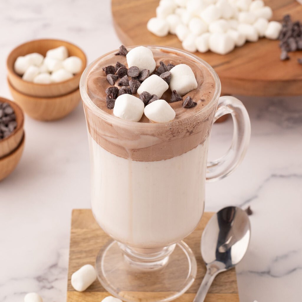 Whipped Hot Chocolate topped with marshmallows and mini chocolate chips.