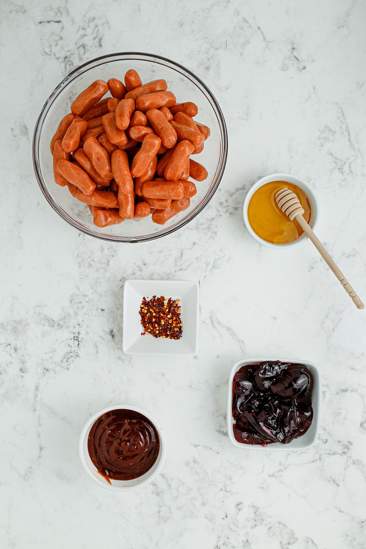 Ingredients to make BBQ Little Smokies are set out on the counter.