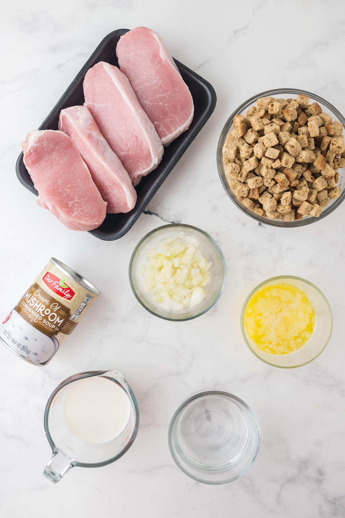 Ingredients to make Pork Chops and Stuffing set out on the counter.
