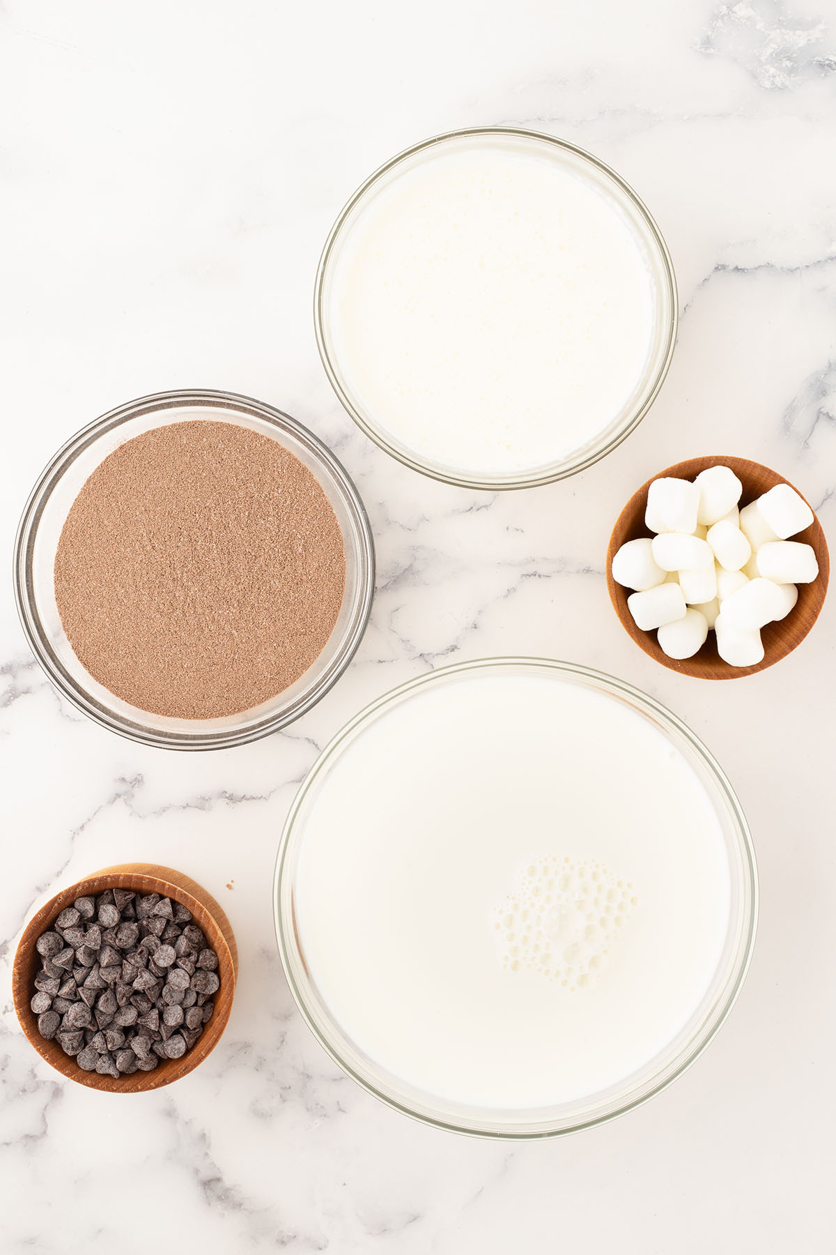 Ingredients to make Whipped Hot Chocolate are set out on the counter.