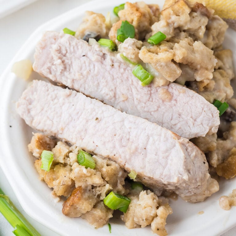 Pork Chops and Stuffing served on a white plate.