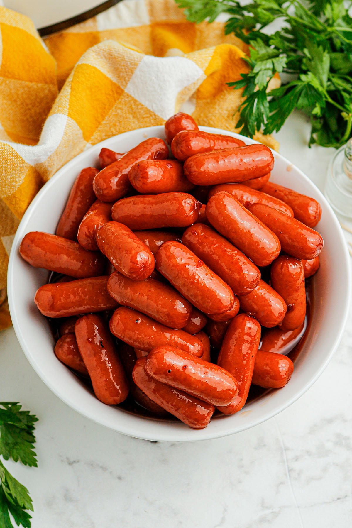 Honey BBQ Little Smokies in a large white serving bowl.