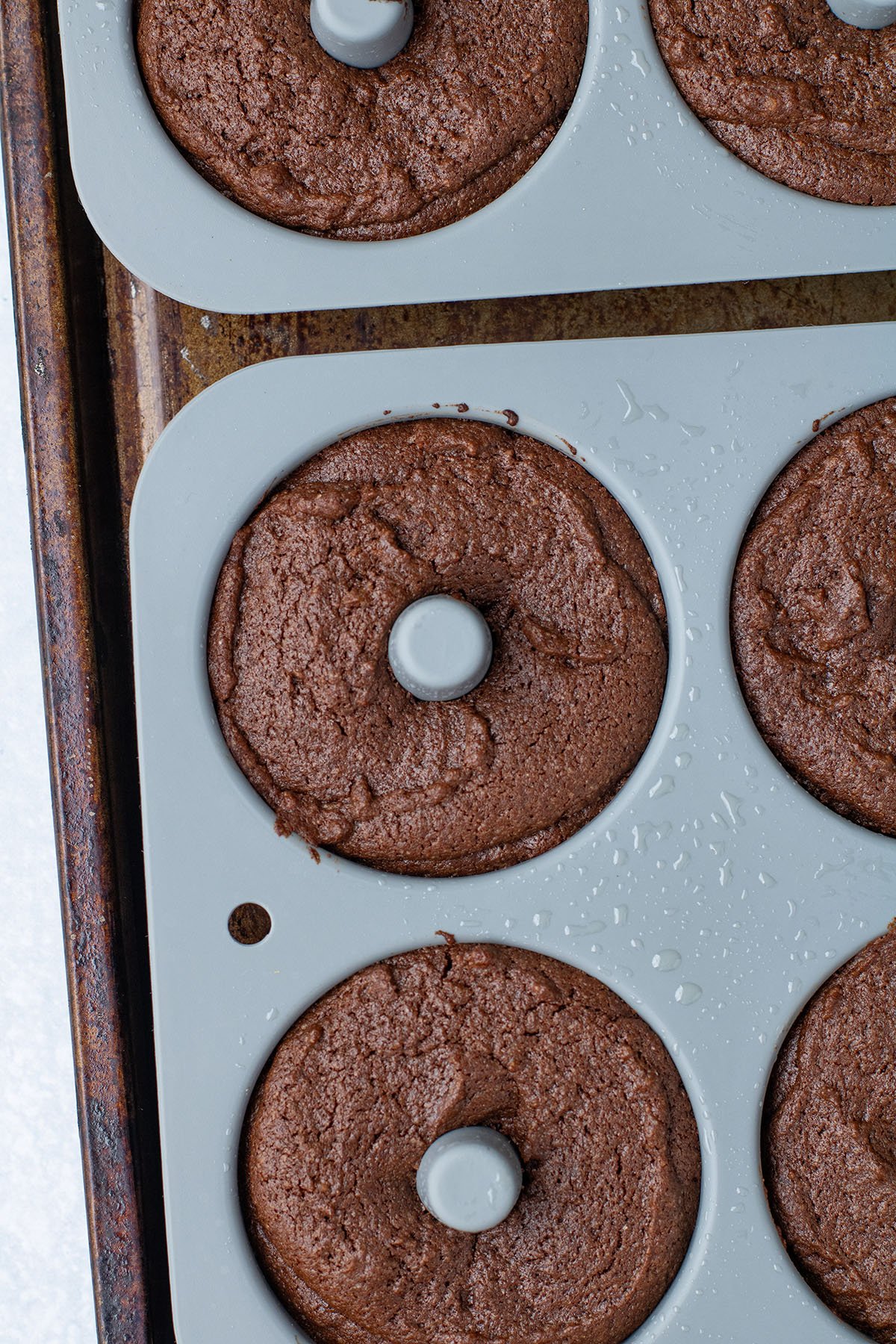 Baked Caramel Pecan Brownie Donut in a donut pan.