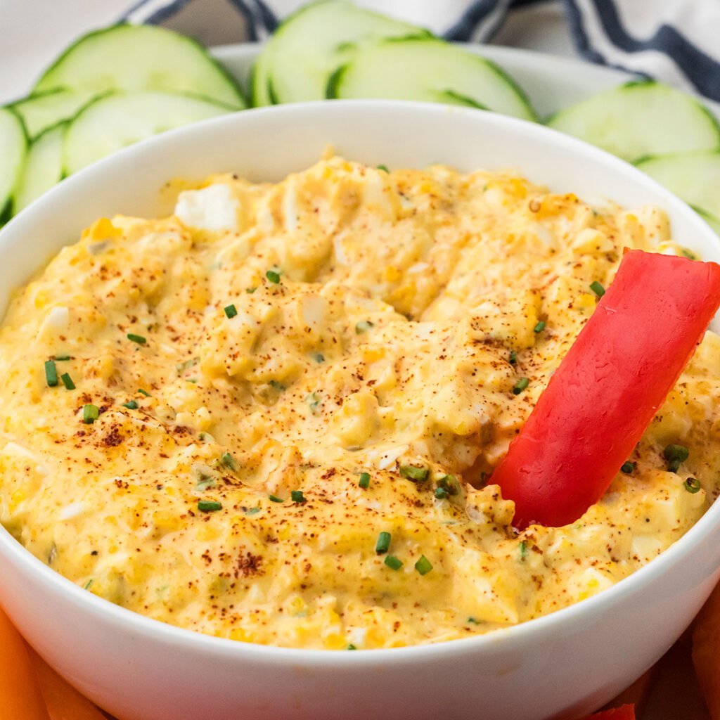 Deviled Egg Dip in a white serving bowl.