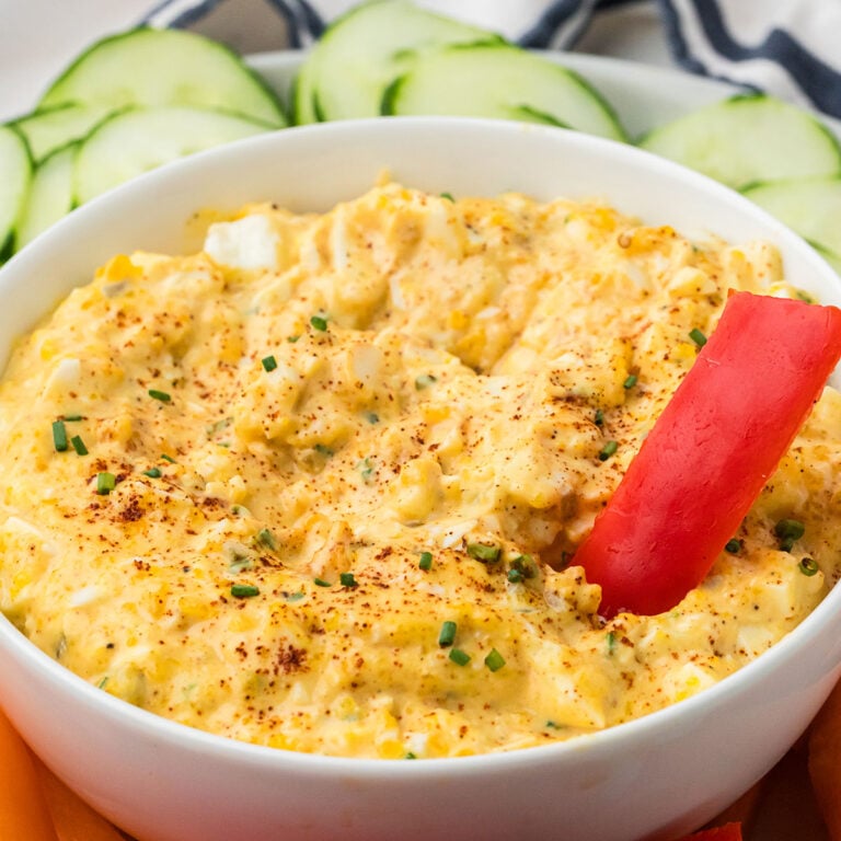 Deviled Egg Dip in a white serving bowl.