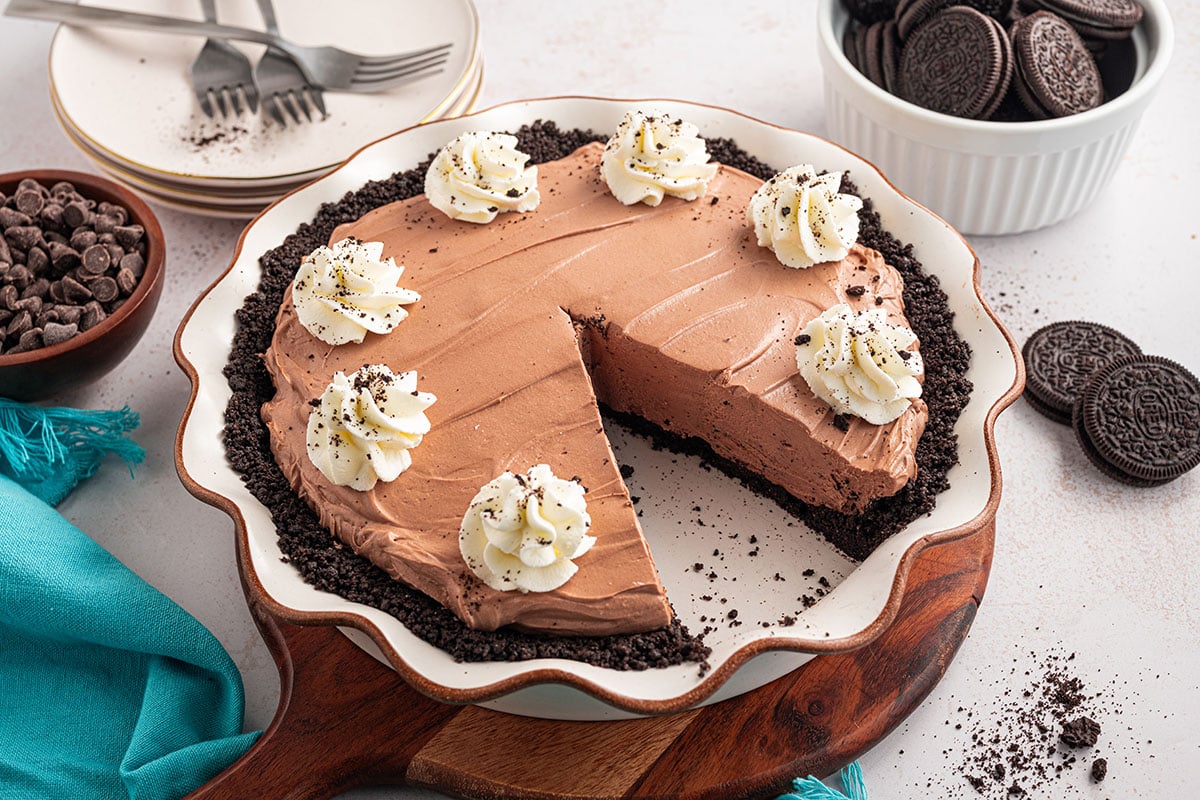 Chocolate Cheesecake Pie in a pie plate with a slice cut out.
