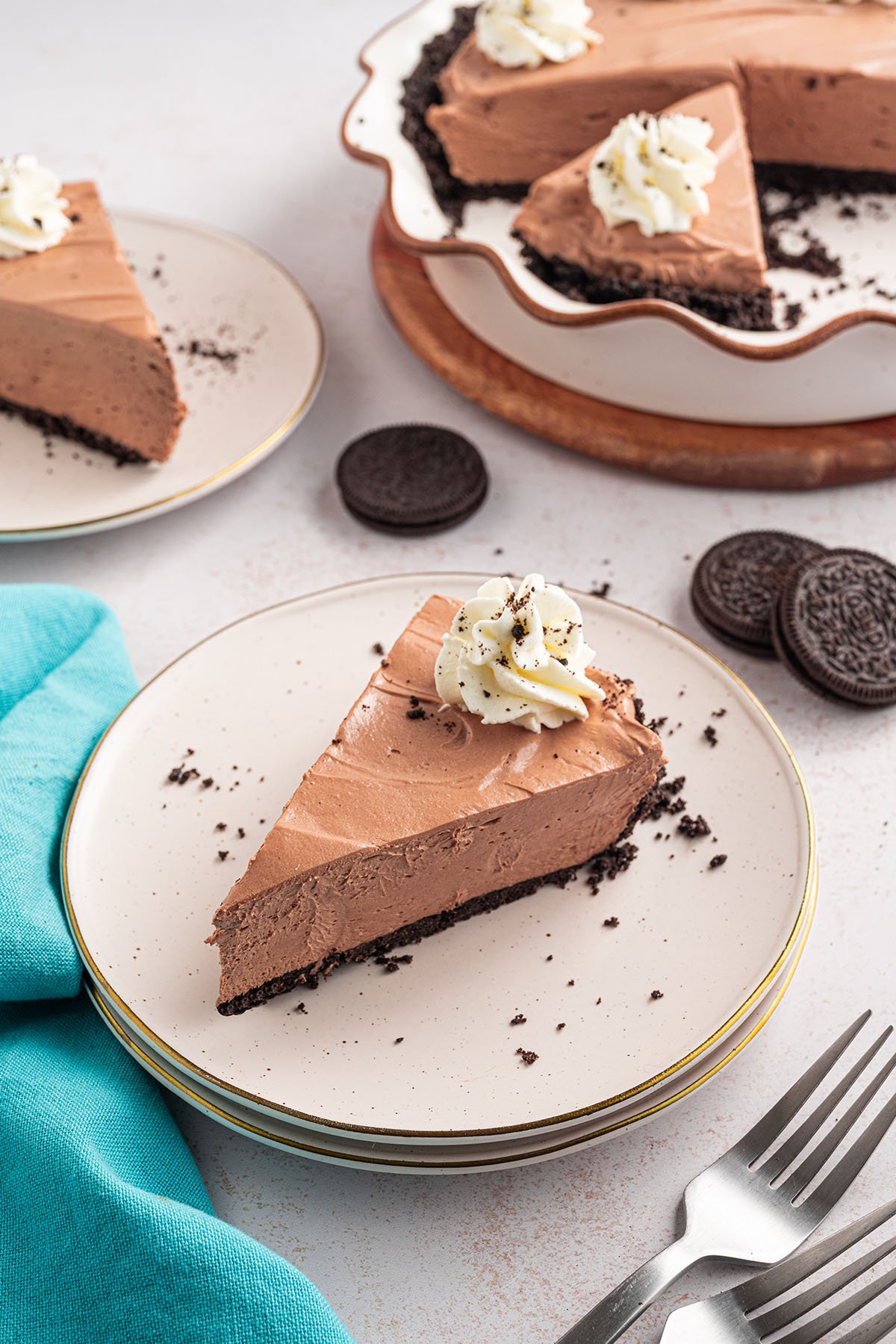 A slice of Chocolate Cheesecake Pie on a white plate.