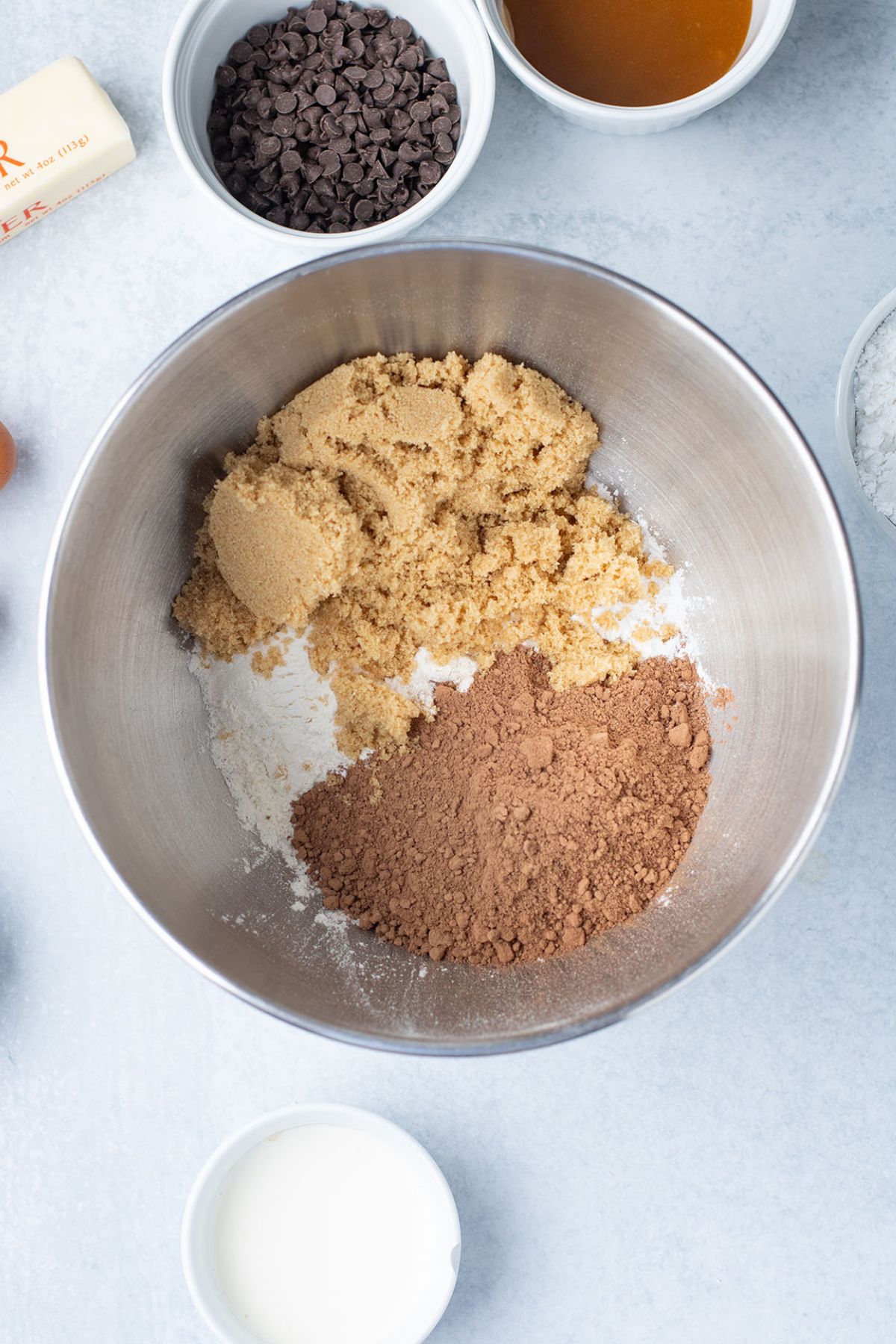 Flour, cocoa powder, brown sugar, and baking powder in a mixing bowl.