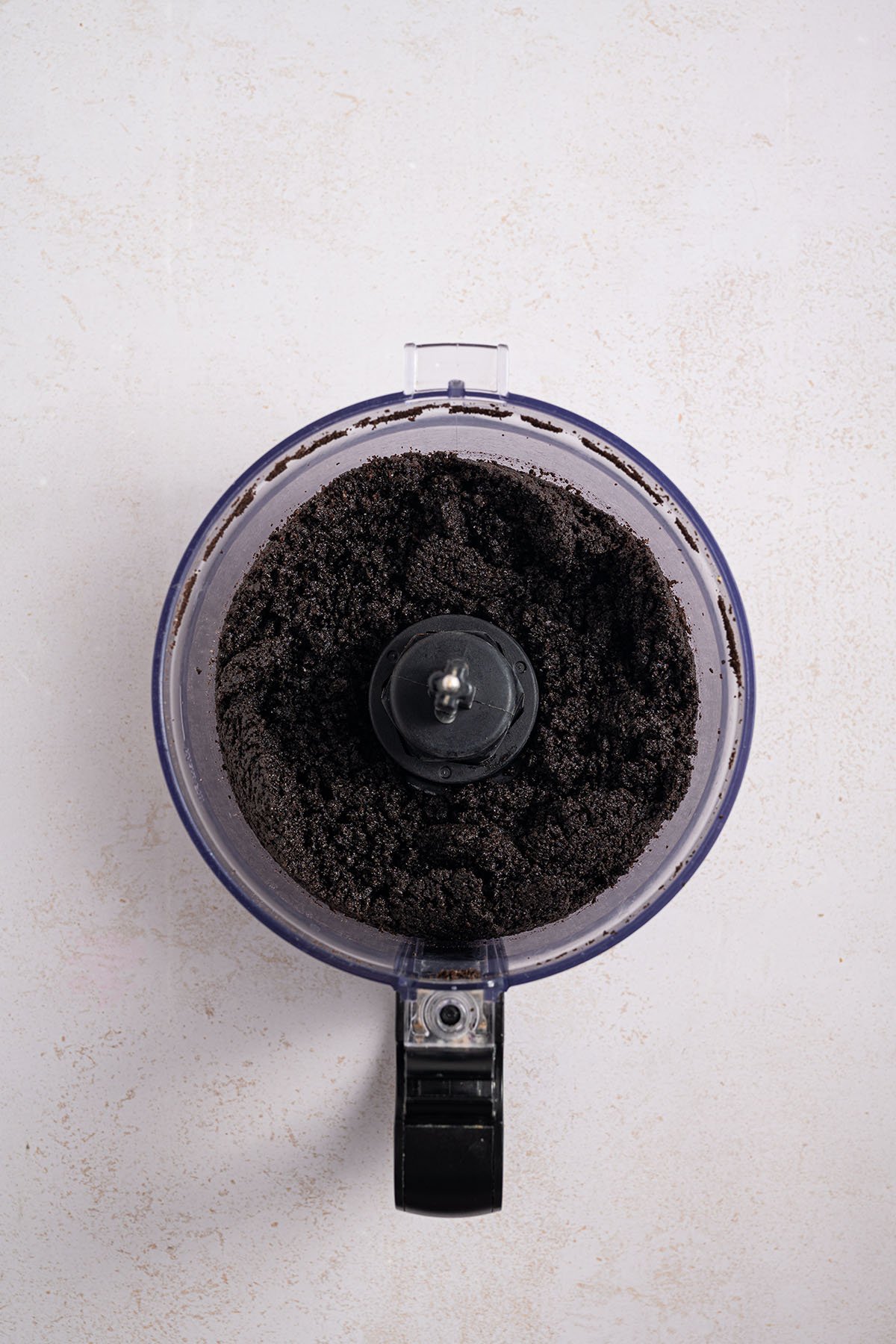 Oreo crumbs in the food processor.