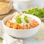 Lasagna soup served in a white bowl.