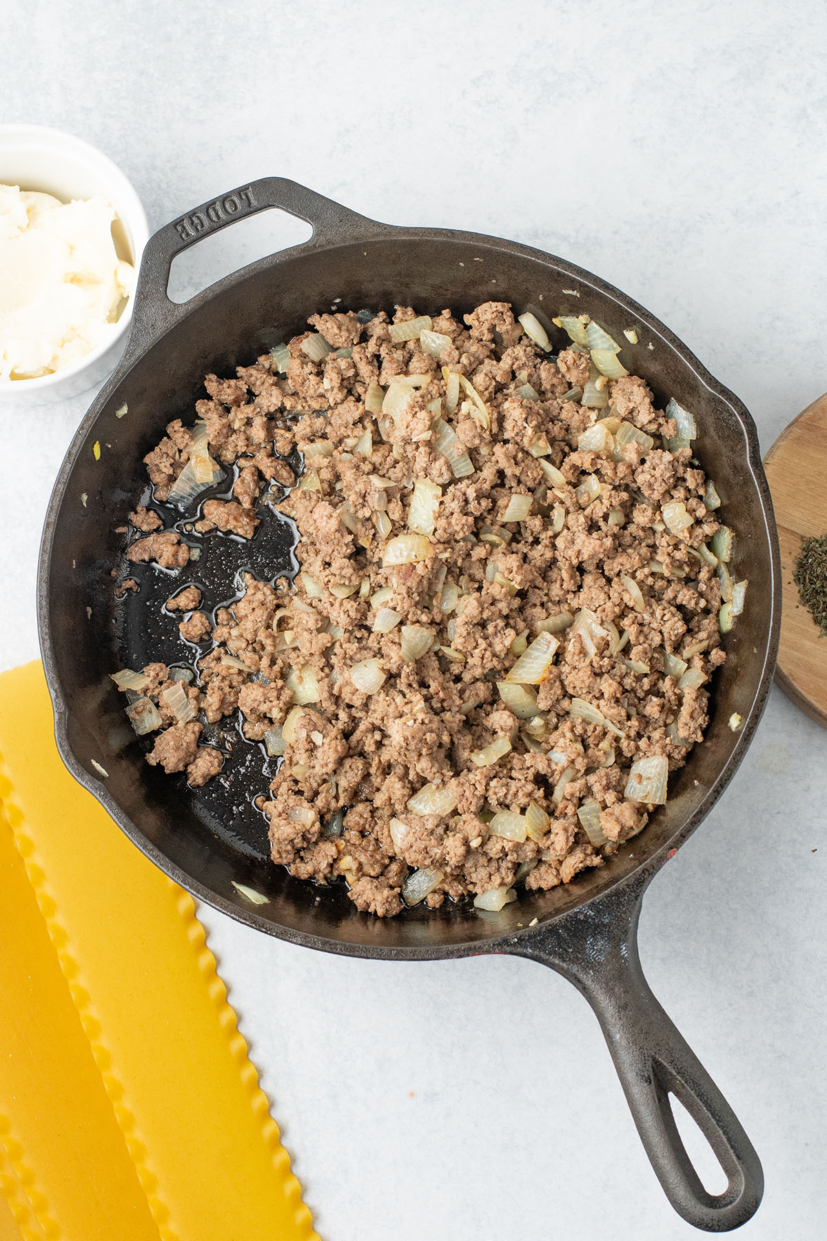 Cooked ground beef,  onions, and garlic in the cast iron skillet.